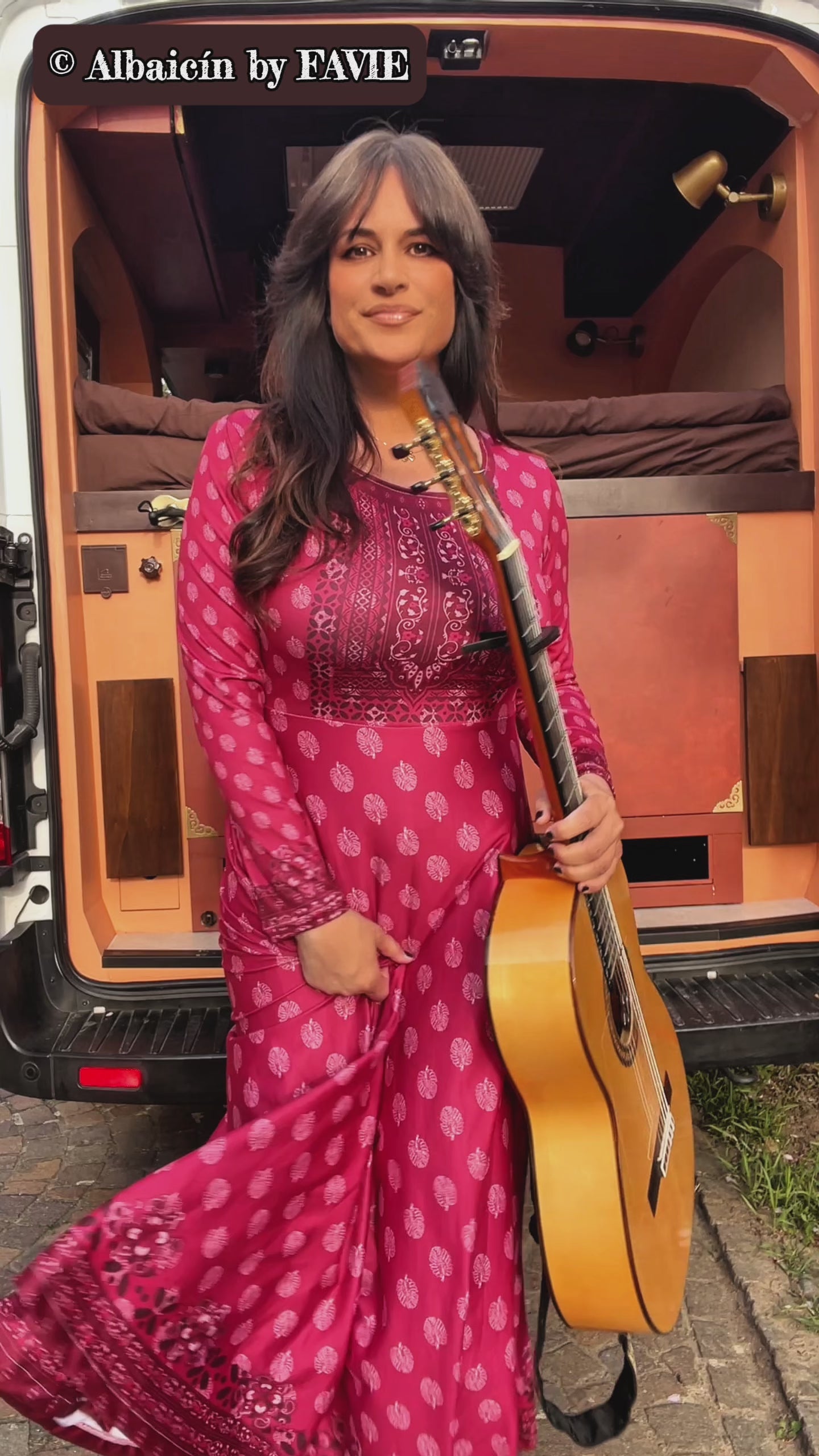 Video of a woman wearing the Rani Rouge Jaipur Kurta Dress, a red-pink bohemian maxi dress with original FAVIE artwork.